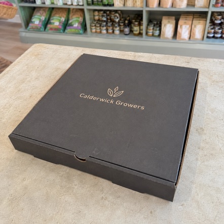 Kraft 14" large pizza boxes printed with the Crust and Ember logo