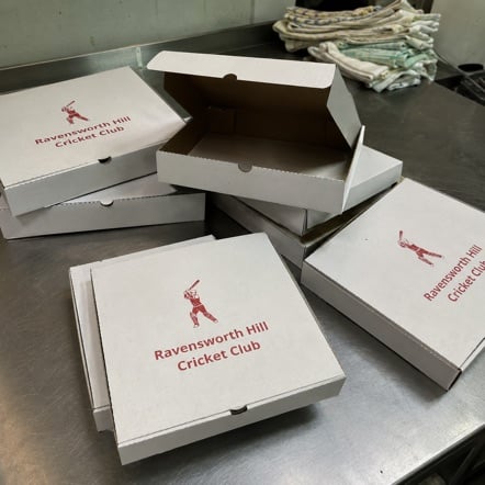 Stack of kraft 10" personal pizza boxes printed with the Slice and Co logo